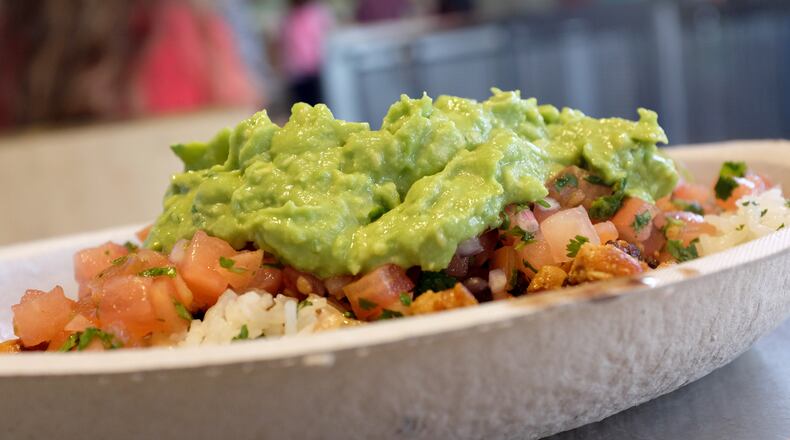 Chipotle announced Monday, Feb. 10,  that to celebrate the upcoming one-year anniversary of Chipotle Rewards, it is launching "Guac Mode" and will give away free guacamole and extras to current and new loyalty program members throughout 2020. JOE RAEDLE/GETTY IMAGES