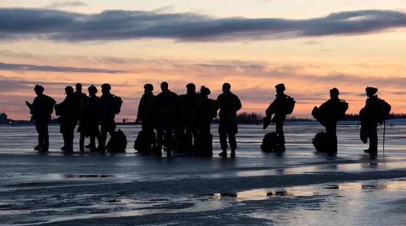 U.S. Air Force tactical air control party (TACP) specialists from Detachment 1, 3rd Air Support Operations Squadron, and combat weather Airmen assigned to Detachment 3, 1st Combat Weather Squadron, wait to board an Alaska Air National Guard C-17 Globemaster III while conducting airborne operations at Joint Base Elmendorf-Richardson, Alaska, Feb. 22, 2022. (U.S. Air Force photo by Alejandro Peña)