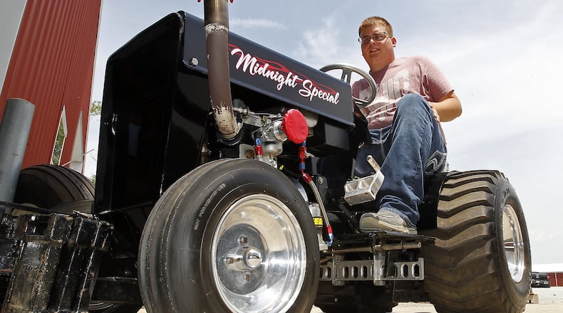 Levi Kimley sits on the Midnight Special that he will compete with in the lawn tractor pulls at the Clark County Fair. Bill Lackey/Staff