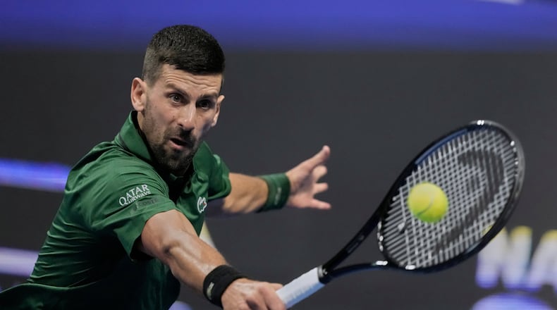 Novak Djokovic of Serbia plays a shot against Alejandro Tabilo of Chile during the ATP tournament round of 16 tennis match, in Athens, Greece, Tuesday, Nov. 4, 2025. (AP Photo/Petros Giannakouris)