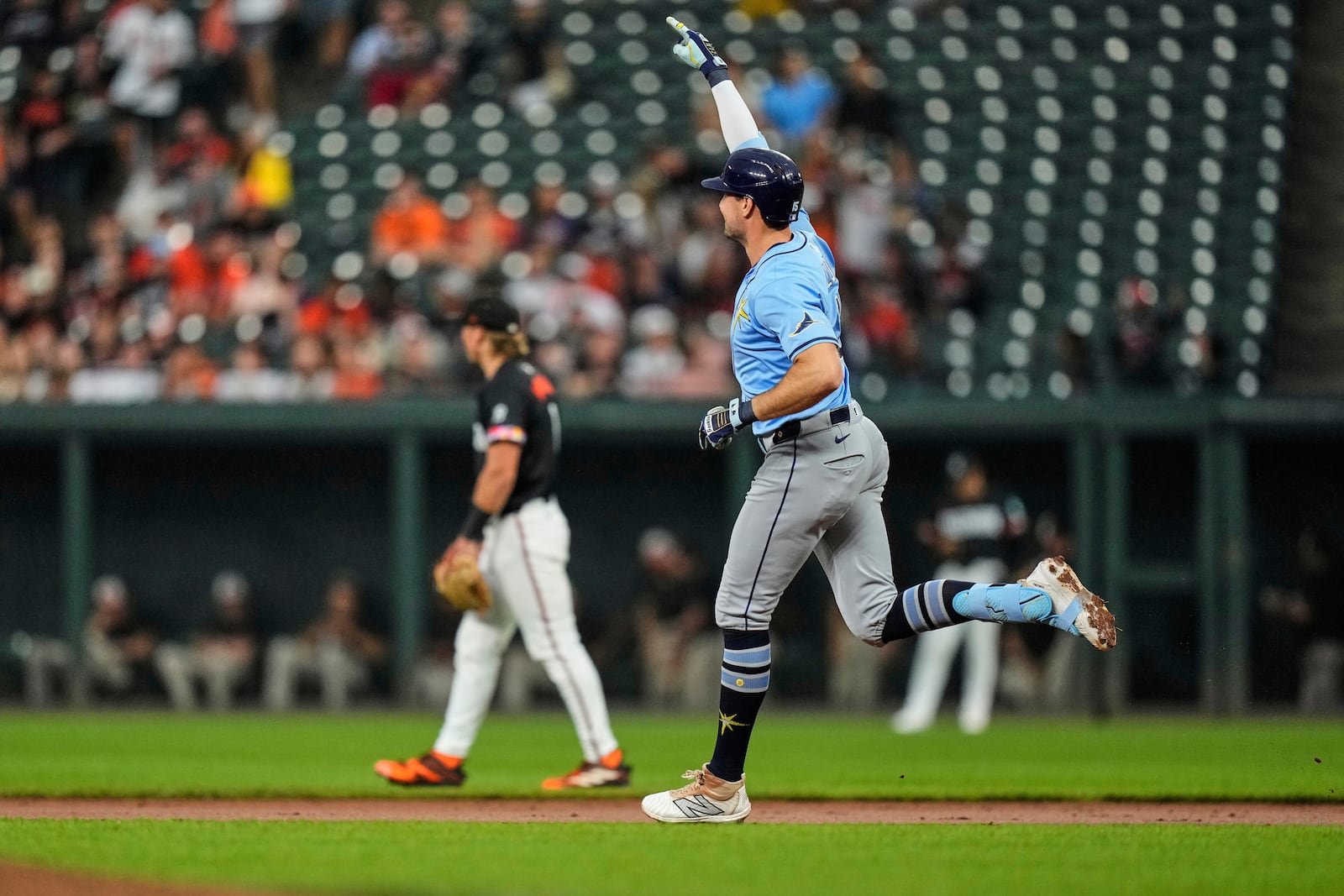 Tampa Bay Rays' Josh Lowe, right, rounds the bases after hitting a home run during the second inning of a baseball game against the Baltimore Orioles, Friday, June 27, 2025, in Baltimore. (AP Photo/Stephanie Scarbrough)