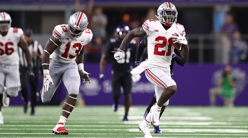 ARLINGTON, TX - SEPTEMBER 15:  Parris Campbell #21 of the Ohio State Buckeyes runs for a touchdown against the TCU Horned Frogs in the third quarter during The AdvoCare Showdown at AT&T Stadium on September 15, 2018 in Arlington, Texas.  (Photo by Ronald Martinez/Getty Images)