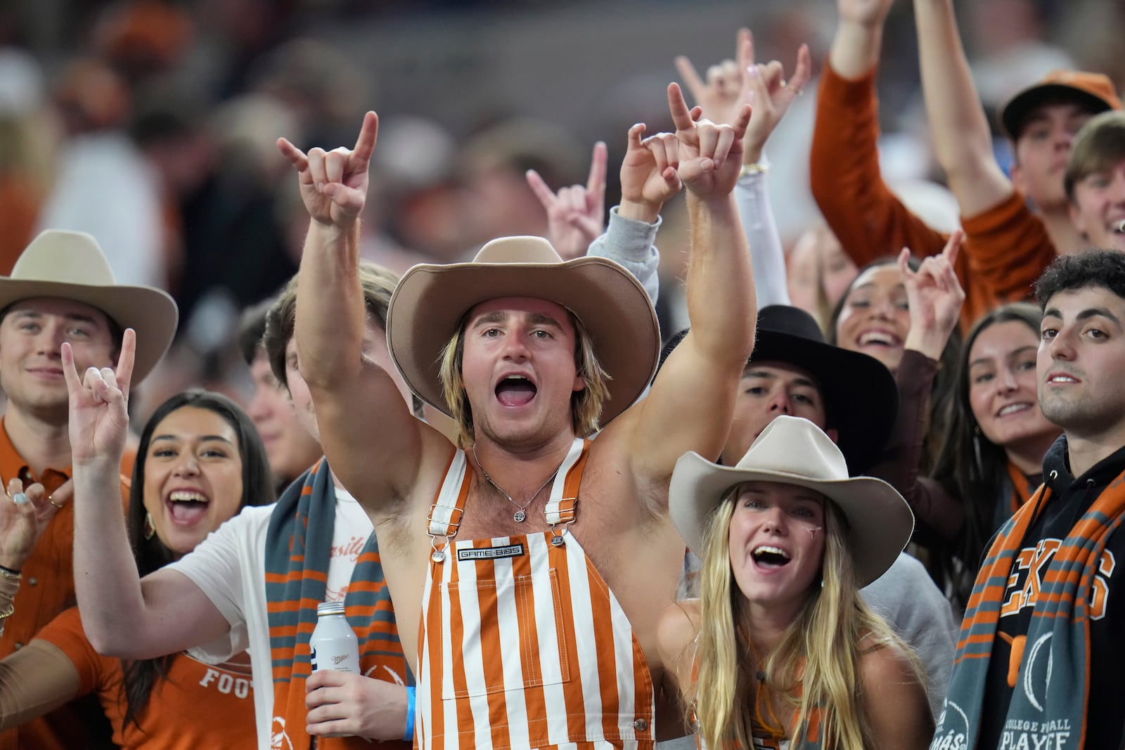 FILE - Texas fans cheer during the first half of the Cotton Bowl College Football Playoff semifinal game between Texas and Ohio State, Friday, Jan. 10, 2025, in Arlington, Texas. (AP Photo/Julio Cortez, File)