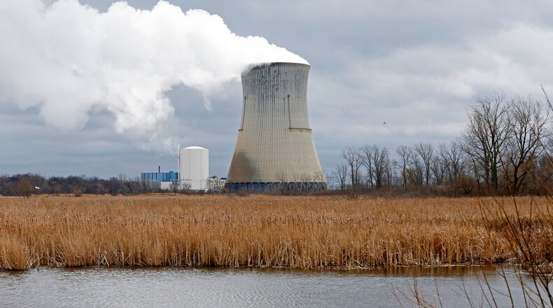 FILE - This April 4, 2017 file photo shows the then-FirstEnergy Corp.'s Davis-Besse Nuclear Power Station in Oak Harbor, Ohio. The fate of the legislation that aimed to bailout Ohio's two nuclear plants remains unclear as the Legislature meets for a final session Tuesday, Dec. 22, 2020, to discuss any potential bill that would remedy, delay or repeal portions of the legislation. (AP Photo/Ron Schwane, File)
