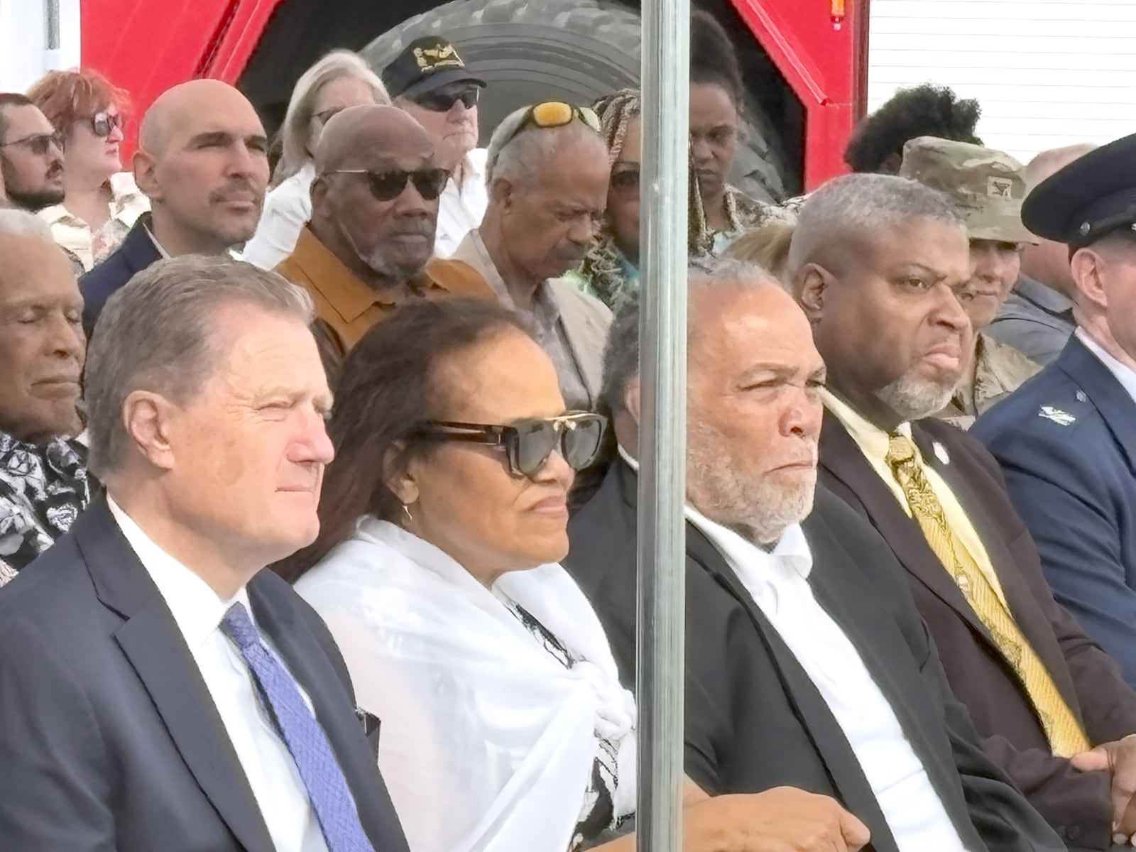 At Saturday’s dedication ceremony of the Elmer “Bill” Ross Fire Station 2 at Wright Patterson Air Force Base (left to right) Congressman Mike Turner; Angie Weaver, Bill’s daughter; Steve Ross, Bill’s son; and Derrick Foward, the president of the Dayton chapter of the NAACP, listen to the praise of Bill Ross by Colonel Dustin Richards who was at the podium. TOM ARCHDEACON / CONTRIBUTED PHOTO