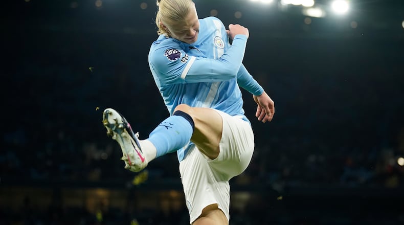 Manchester City's Erling Haaland reacts after missing a chance to score a goal during the English Premier League soccer match between Manchester City and West Ham United in Manchester, England, Saturday, Dec. 20, 2025. (AP Photo/Dave Thompson)