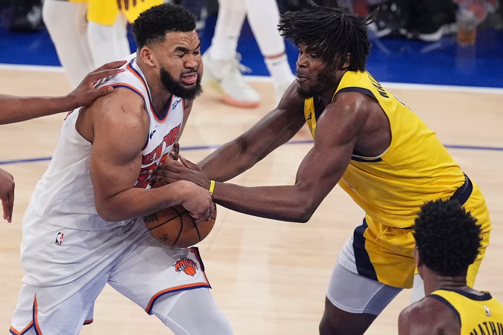 Indiana Pacers guard Bennedict Mathurin (00) strips the ball from New York Knicks center Karl-Anthony Towns (32) during the fourth quarter of Game 5 of the NBA basketball Eastern Conference final, Thursday, May 29, 2025, in New York. (AP Photo/Frank Franklin II)