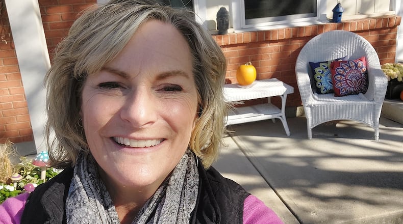 Kim Bramlage bought her first home in Forest Ridge in 2021 from her best friend, Kay Plzak Fuhrman and her brothers. The home was where Fuhrman grew up and where her parents lived since 1965. Bramlage is stands in front of her home with her dog Buck. CONTRIBUTED