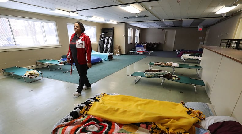 Larina Bias, program manager at Interfaith Hospitality Network, walks through overflow sleeping room at the Network’s Family Shelter in this file photo. Bill Lackey/Staff