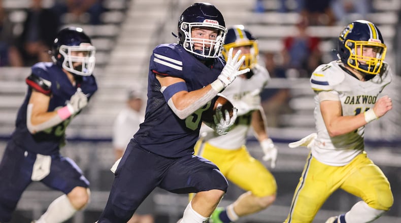 Oakwood senior Anthony Valenti runs during a 40-yard touchdown run early in the fourth quarter of a Southwestern Buckeye League game against Oakwood on Friday, Sept. 20 at Niswonger Field in Germantown. It was the decisive touchdown in a 20-19 victory. BRYANT BILLING / STAFF