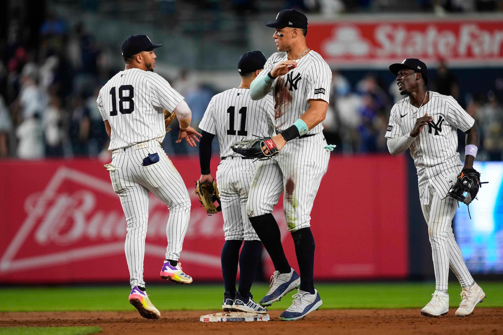 New York Yankees players, including outfielder Aaron Judge, second from right, celebrate after winning a baseball game against the Chicago Cubs, Friday, July 11, 2025, in New York. (AP Photo/Yuki Iwamura)