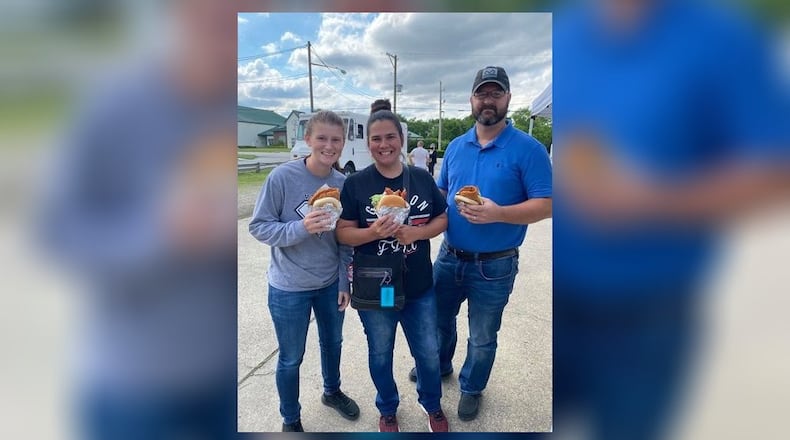 The Gossett Family enjoyed their sandwiches standing up. HEATHER STEWART-RIGSBEE/CONTRIBUTED