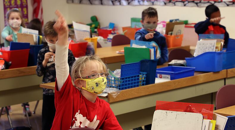 How Clark and Champaign schools are planning to help students bridge the learning gap. Here, kindergarten students from Reid School practice their letters at The Village. BILL LACKEY/STAFF