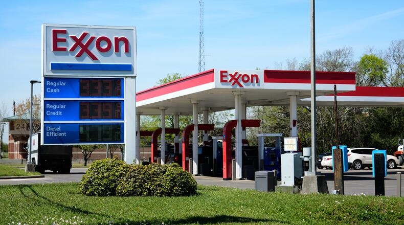 Prices are displayed on an Exxon gas station sign in Houston, Tuesday, March 17, 2026. (AP Photo/Ashley Landis)