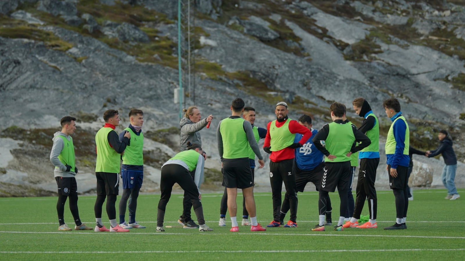 Greenland's soccer and futsal players huddle during a training session at Nuuk stadium in Nuuk, Greenland, Tuesday, June 17, 2025. (AP Photo/Kwiyeon Ha)