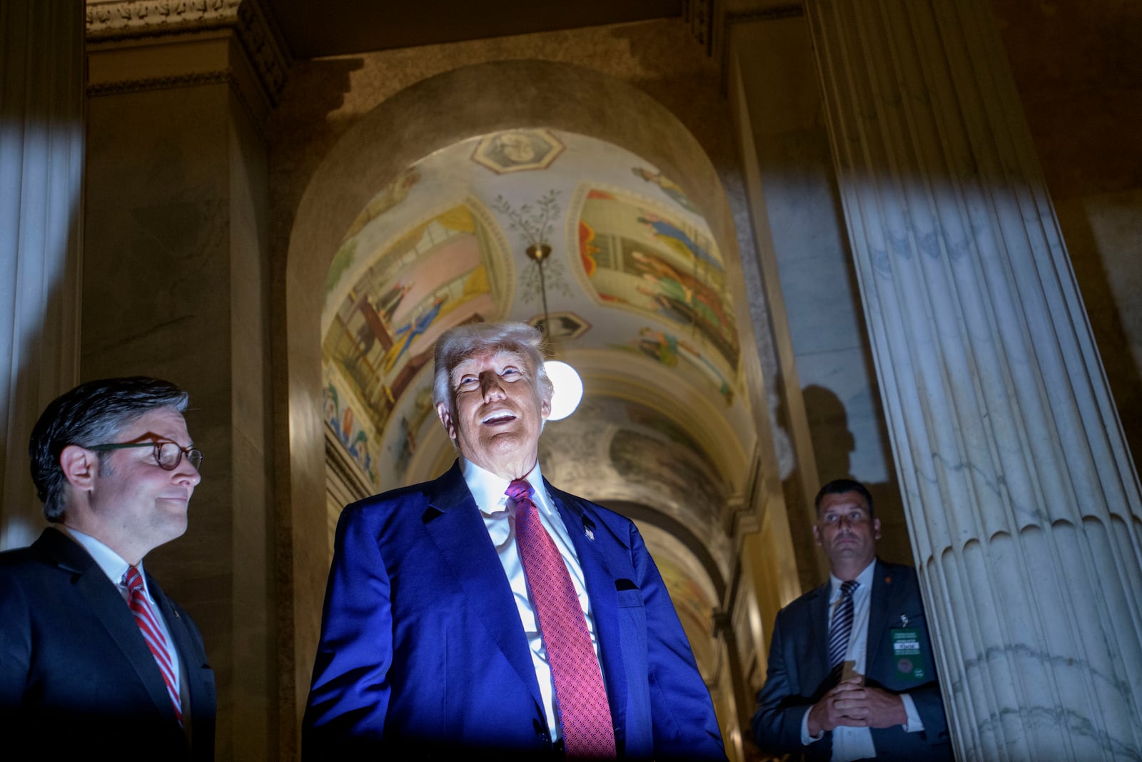 President Donald Trump, right, is joined by Speaker of the House Mike Johnson, R-La., left, as he speaks with reporters upon his departure from the Capitol following a meeting with the House Republican Conference, Tuesday, May 20, 2025, in Washington. (AP Photo/Rod Lamkey, Jr.)