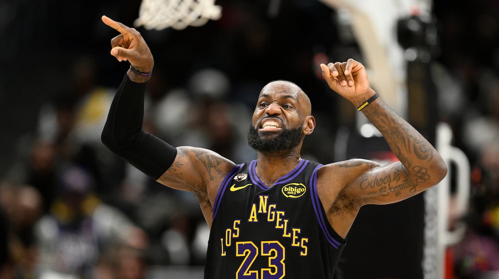 Los Angeles Lakers forward LeBron James gestures during the first half of an NBA basketball game against the Washington Wizards, Friday, Jan. 30, 2026, in Washington. (AP Photo/Nick Wass)