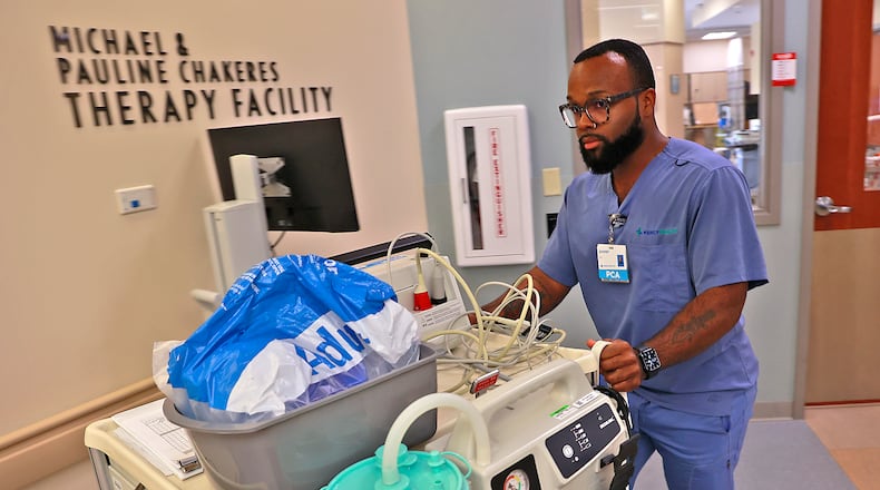 Juwan Walker participated in the patient care tech training program at Mercy Health - Springfield Regional Medical Center and now works at the hospital. BILL LACKEY/STAFF