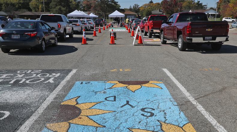 The Clark County Combined Health District held a free drive-thru COVID-19 testing clinic in the parking lot of Kenton Ridge High School on Oct. 17. BILL LACKEY/STAFF