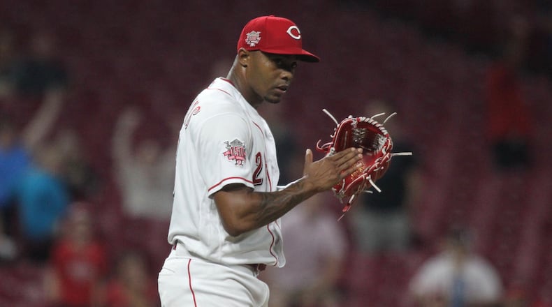 Reds reliever Raisel Iglesias claps after the final out of a victory against the Angels on Tuesday, Aug. 6, 2019, at Great American Ball Park in Cincinnati. David Jablonski/Staff