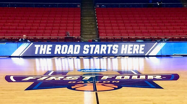 Mid-court sign, "The Road Starts Here" at the First Four at UD Arena in Dayton, Ohio.