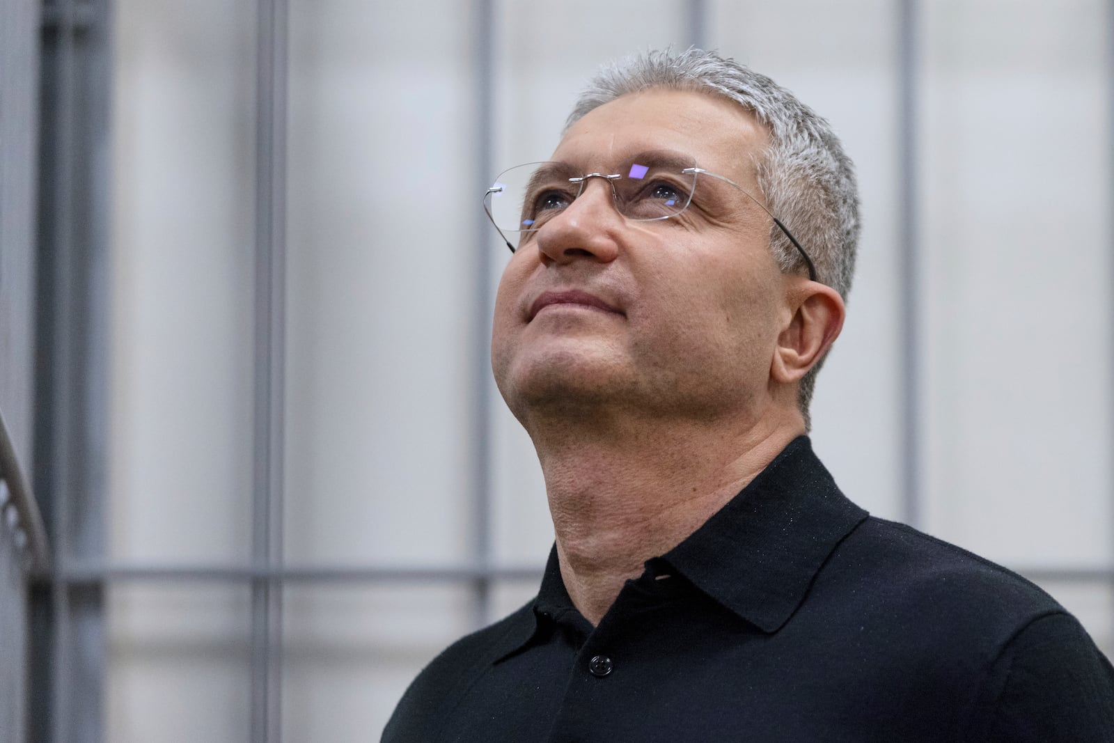 Timur Ivanov, Russia's former deputy defense minister facing corruption charges, stands in the defendant's cage before a hearing, in the Moscow City Court in Moscow, Russia, Tuesday, July 1, 2025. (AP Photo)
