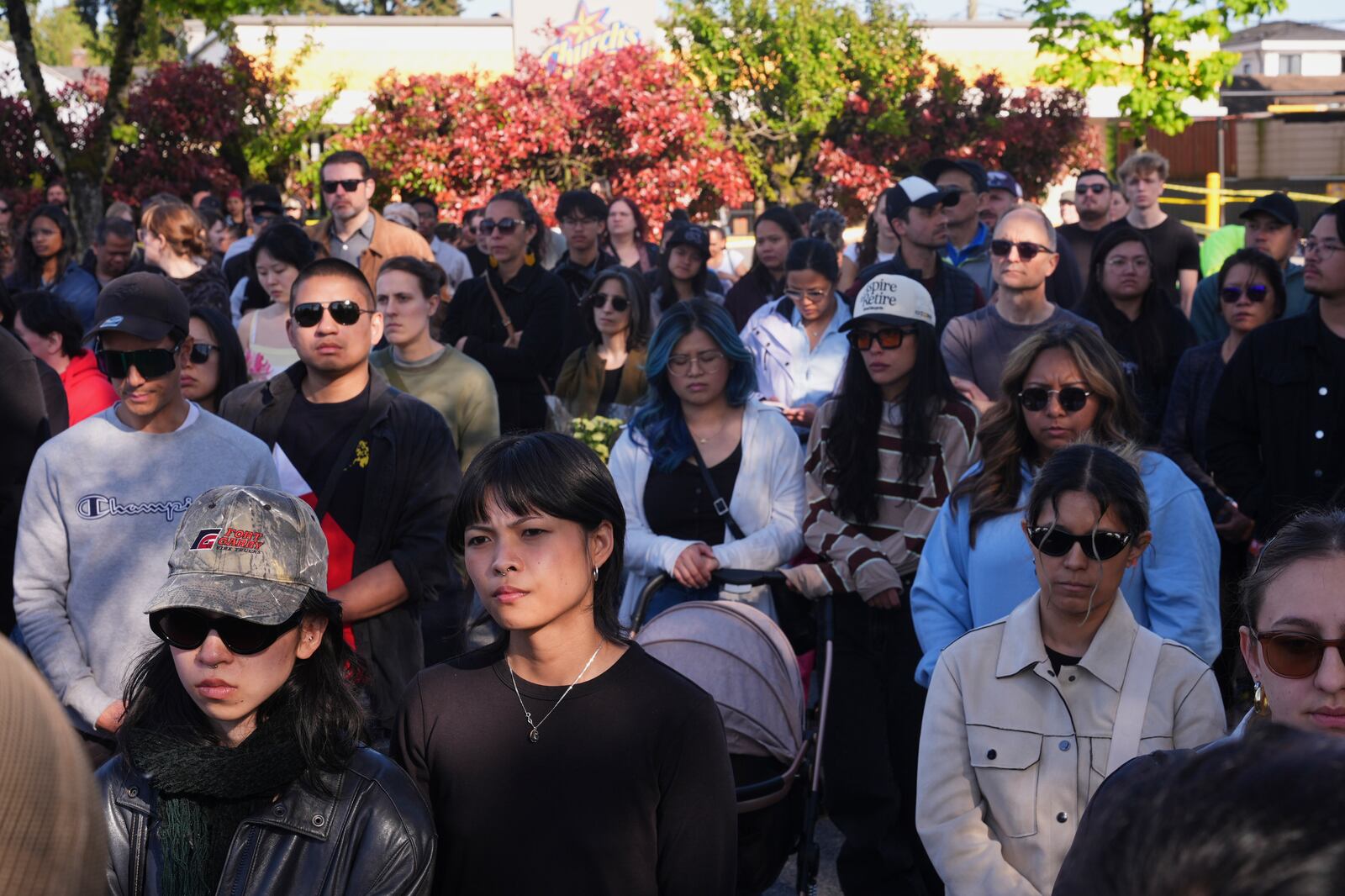 People visit a memorial after a vehicle drove into a crowd during a Filipino heritage festival in Vancouver, British Columbia, Sunday, April 27, 2025. (AP Photo/Lindsey Wasson)