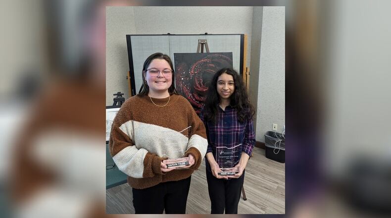 Greenon Local School District eighth grader Violet Breland (right) and senior Kaity Fields (left) placed first and second in the Congressional Art Show. Contributed