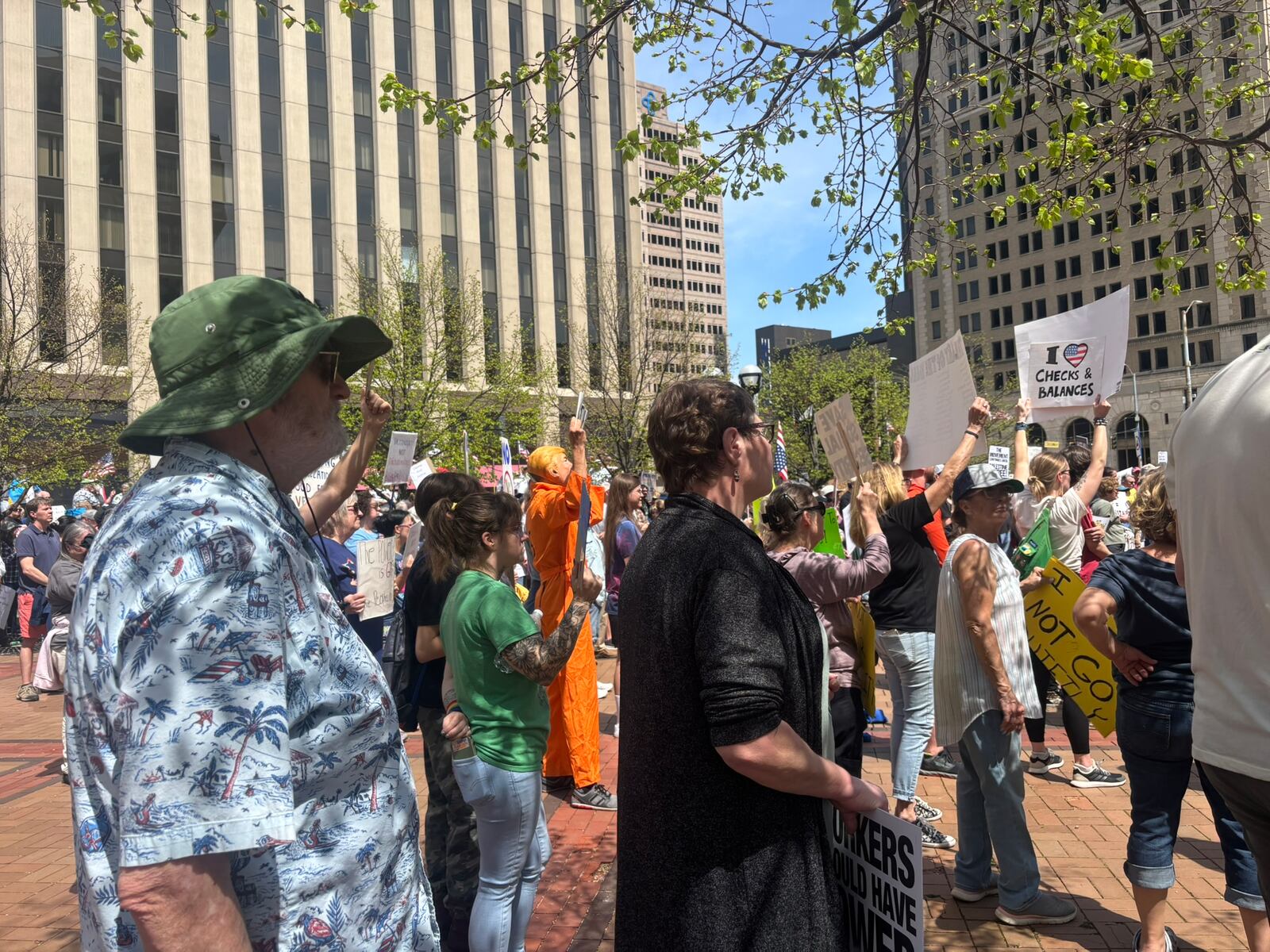 Protestors gather in Courthouse Square in downtown Dayton Saturday for a protest against President Donald Trump. Eileen McClory / staff