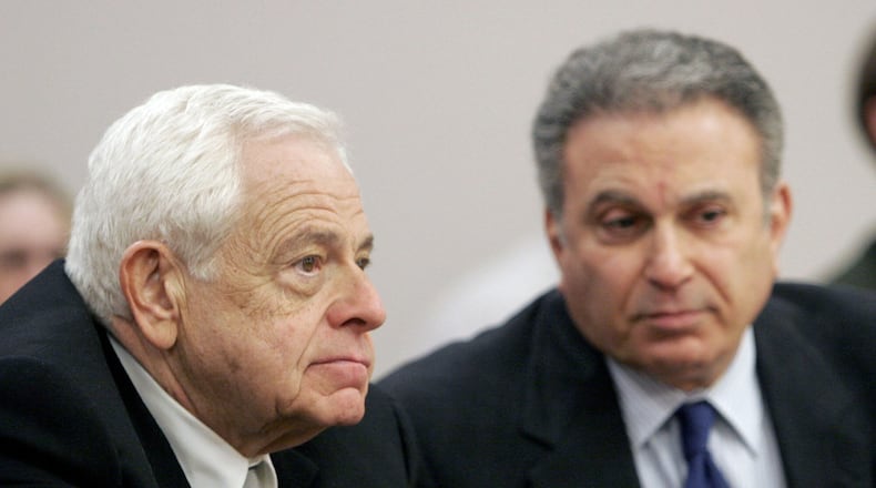 FILE - Plaintiff attorneys Stan Chesley, left, and Robert Steinberg, right, listen to witnesses during a hearing about the amount of the attorneys fees in the $85 million settlement between victims of sexual abuse and the Diocese of Covington Kentucky in Boone County Circuit Court, Tuesday, March 14, 2006 in Burlington, Kentucky. (AP Photo/David Kohl, file)