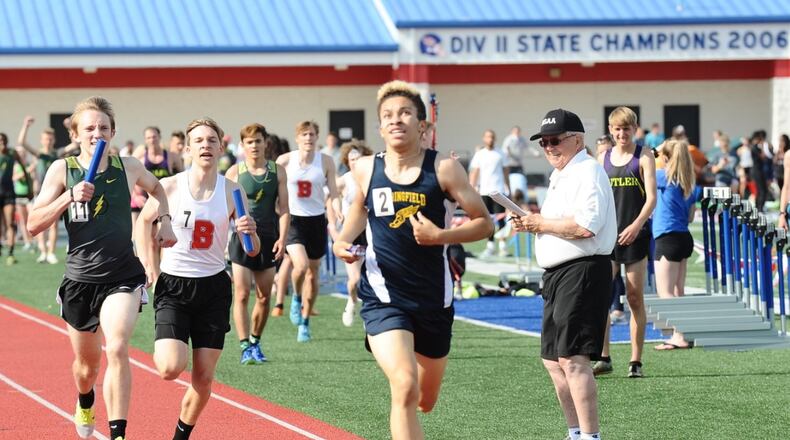 Cameron Elliott of Springfield finishes second in the boys 3,200-meter relay at the Division I district meet Wednesday at Piqua High School. GREG BILLING / CONTRIBUTED
