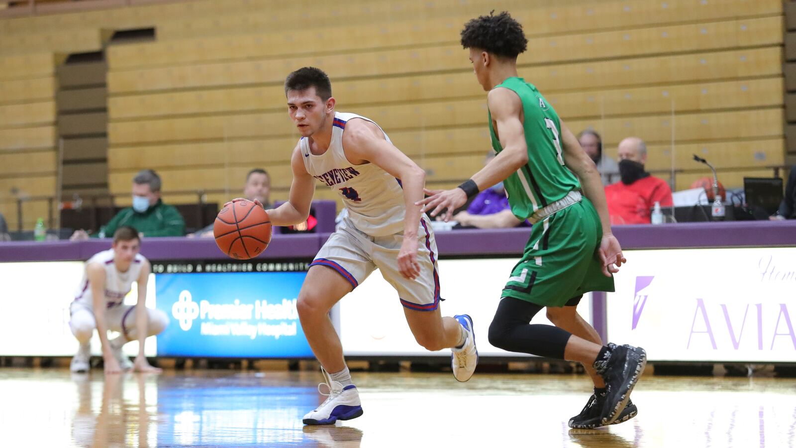Greeneview High School's Rhett Burtch drives past Anna Isaiah Masteller during their game on Friday night at the Vandalia Butler Student Activity Center. The Rockets won 60-59. Michael Cooper/CONTRIBUTED