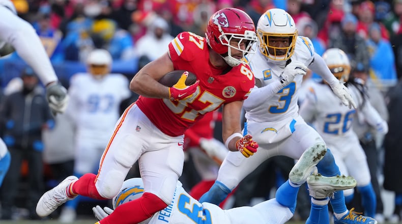 FILE - Kansas City Chiefs tight end Travis Kelce catches a pass against the Los Angeles Chargers during an NFL football game, Dec, 14, 2025, in Kansas City, Mo. (AP Photo/Ed Zurga, File)
