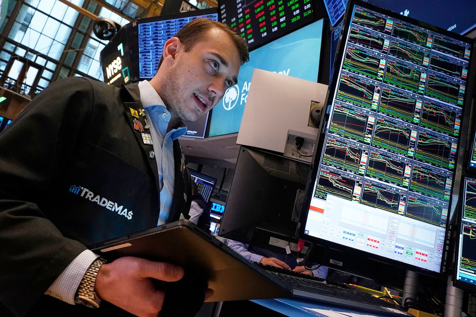 Trader Dylan Halvorsan works on the floor of the New York Stock Exchange, Friday, April 25, 2025. (AP Photo/Richard Drew)