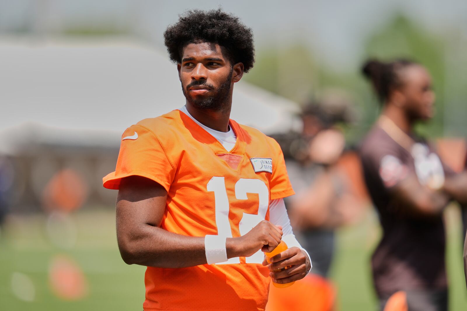 Cleveland Browns quarterback Shedeur Sanders (12) takes a break during NFL football practice in Berea, Ohio, Wednesday, June 4, 2025. (AP Photo/Sue Ogrocki)
