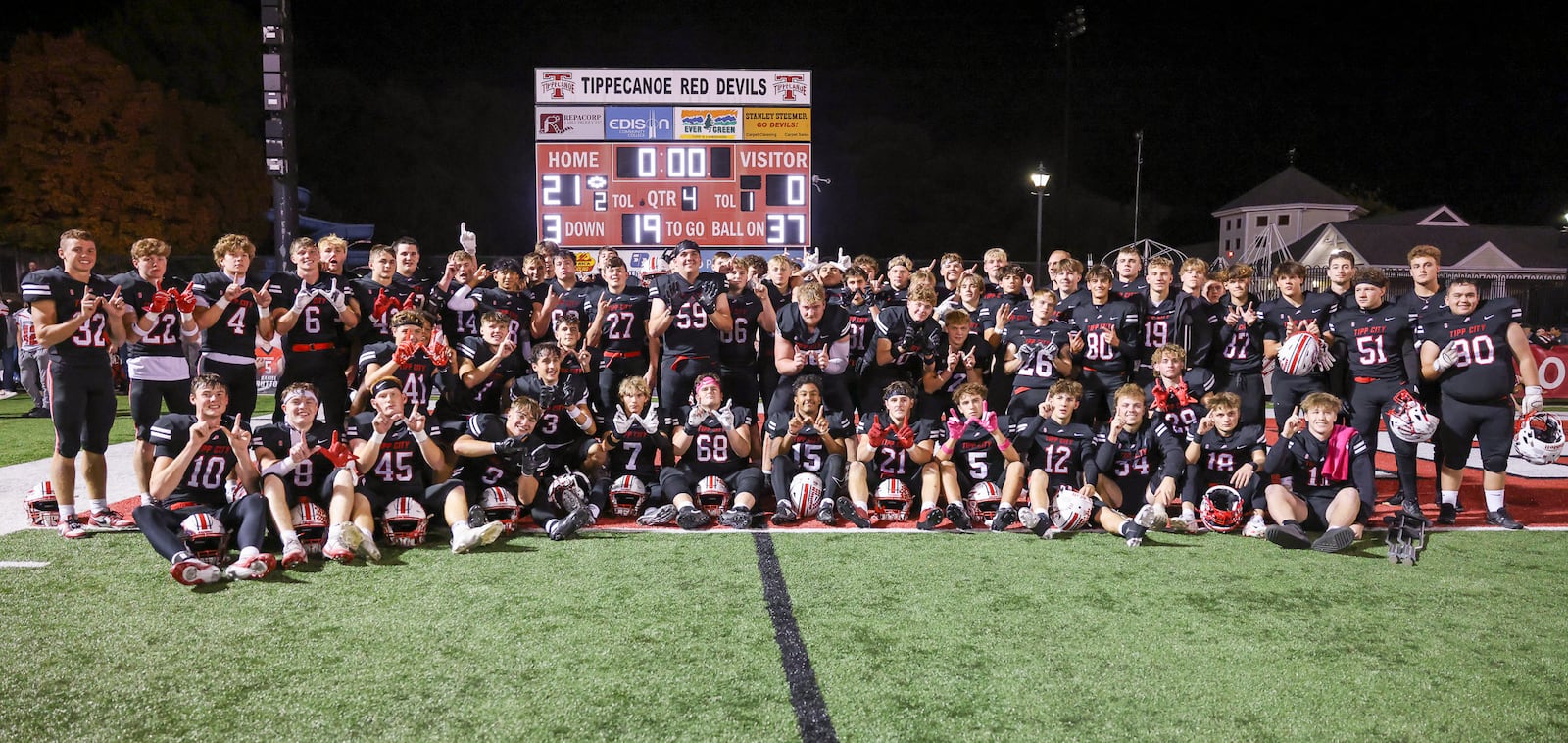 Tippecanoe players pose for a photo after a 21-0 win over Troy on Friday, Oct. 17. The squad secured a share of the overall Miami Valley League title with the victory. BRYANT BILLING / STAFF