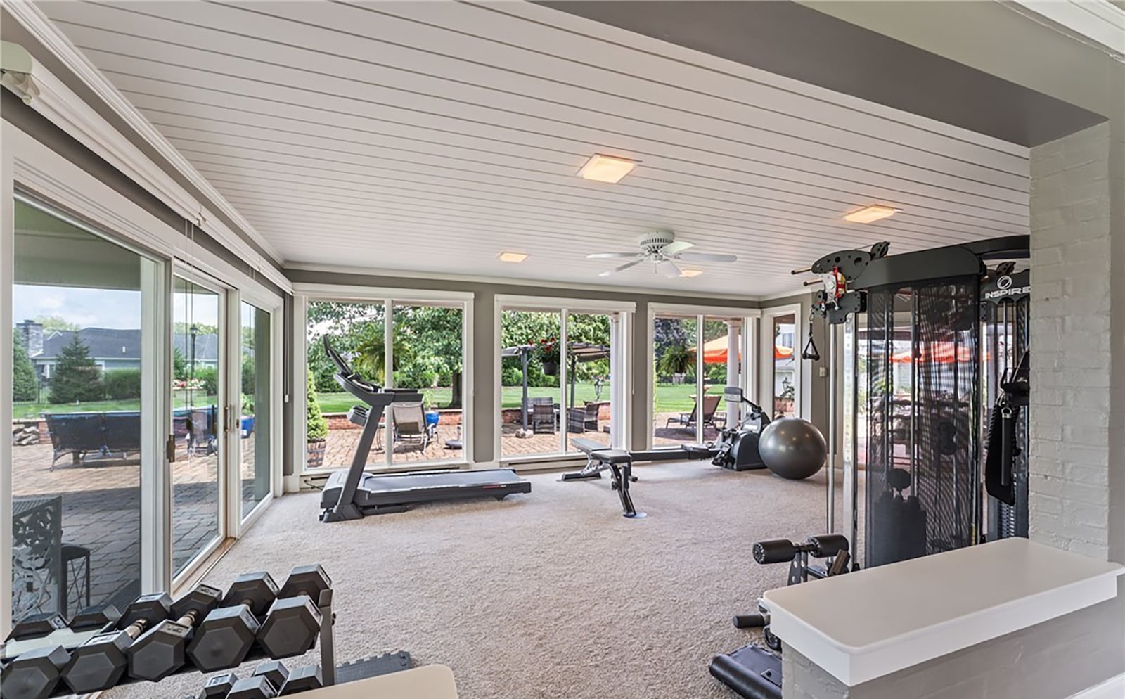 There is a four season/sunroom with carpeting and sliding glass doors opening to the back patio. CONTRIBUTED