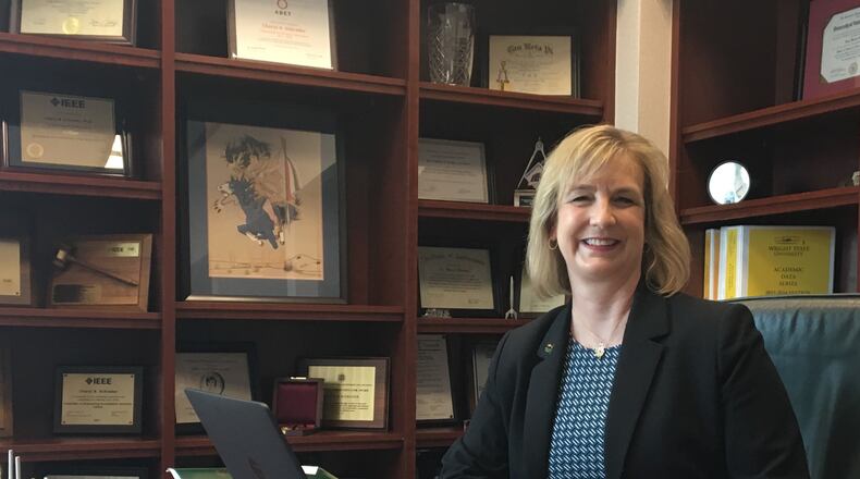 Wright State University president Cheryl Schrader sits behind her desk in her office in University Hall.