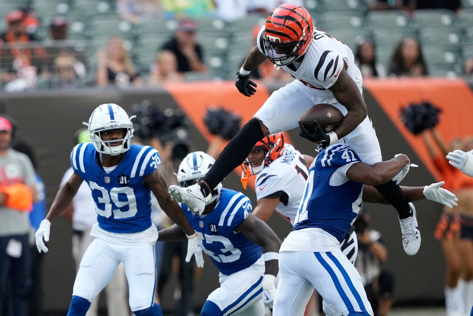 Cincinnati Bengals' Rashod Owens (12) leaps against Indianapolis Colts safety Trey Washington (41)during the second half of a preseason NFL football game, Saturday, Aug. 23, 2025, in Cincinnati. (AP Photo/Carolyn Kaster)