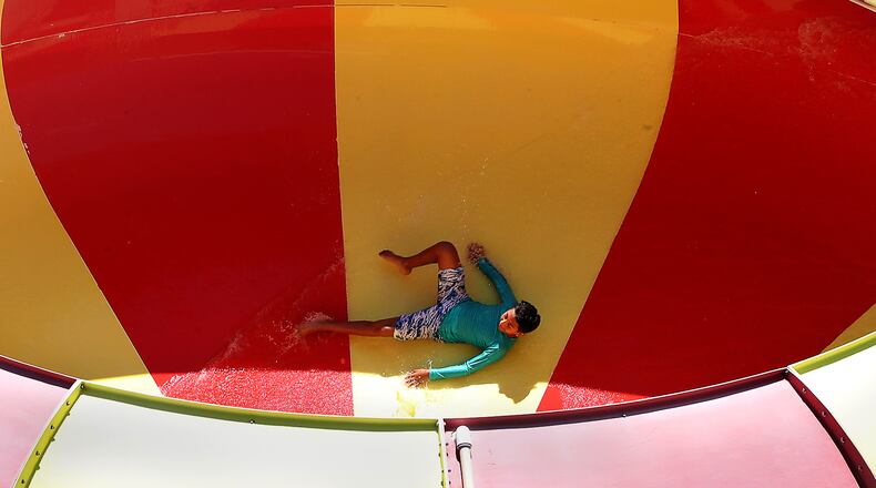 A swimmer spins around the Water Vortex, Ohio's first bowl slide, at Splash Zone in Springfield Tuesday, May 31, 2022. BILL LACKEY/STAFF