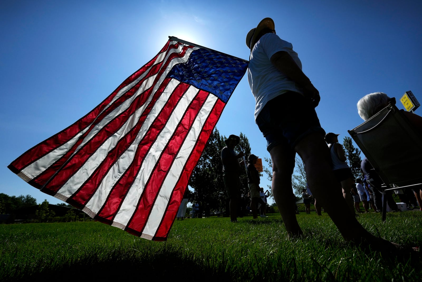 Theresa Peiffer, of Polk City, Iowa, listens to a speaker during an Iowa Democratic Party rally, Thursday, July 3, 2025, in Windsor Heights, Iowa. (AP Photo/Charlie Neibergall)
