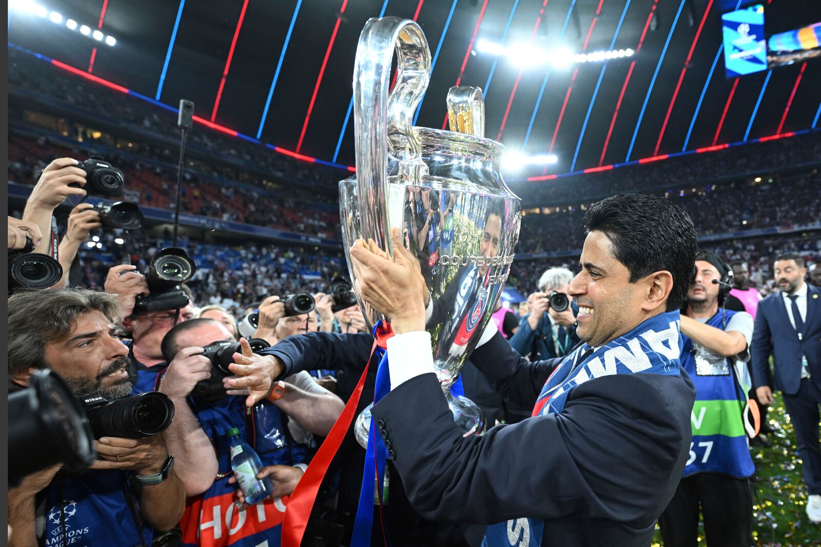 PSG's President Nasser Al-Khelaifi celebrates with the trophy after winning the Champions League final soccer match between Paris Saint Germain and Inter Milan, at the Allianz Arena in Munich, Germany, Saturday, May 31, 2025. (Robert Michael/dpa via AP)