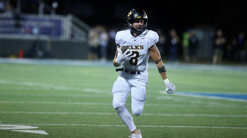 Centerville's Andrew Erwin runs after a catch against Fairmont on Friday, Sept. 13, 2024, at Roush Stadium. David Jablonski/Staff