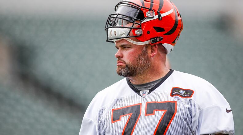 Cincinnati Bengals offensive tackle Andrew Whitworth watches from the sidelines during a break on the first day of mandatory mini camp Tuesday, June 14 at Paul Brown Stadium in Cincinnati. NICK GRAHAM/STAFF