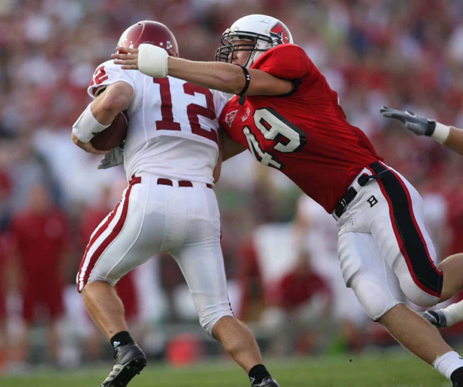 Piqua grad Bryant Haines makes a tackle for Ball State in 2007.
