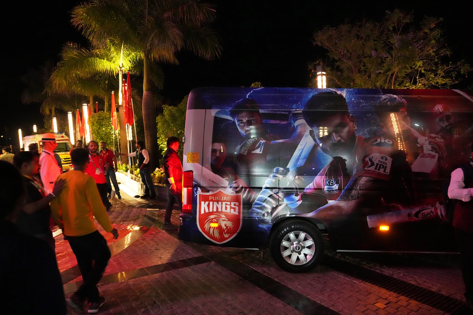 A vehicle waits to transport the players after the authorities asked to evacuate the stadium during the Indian Premier League cricket match between Punjab Kings and Delhi Capitals at Himachal Pradesh Cricket Association Stadium in Dharamshala, India, Thursday, May 8, 2025. (AP Photo/Ashwini Bhatia)
