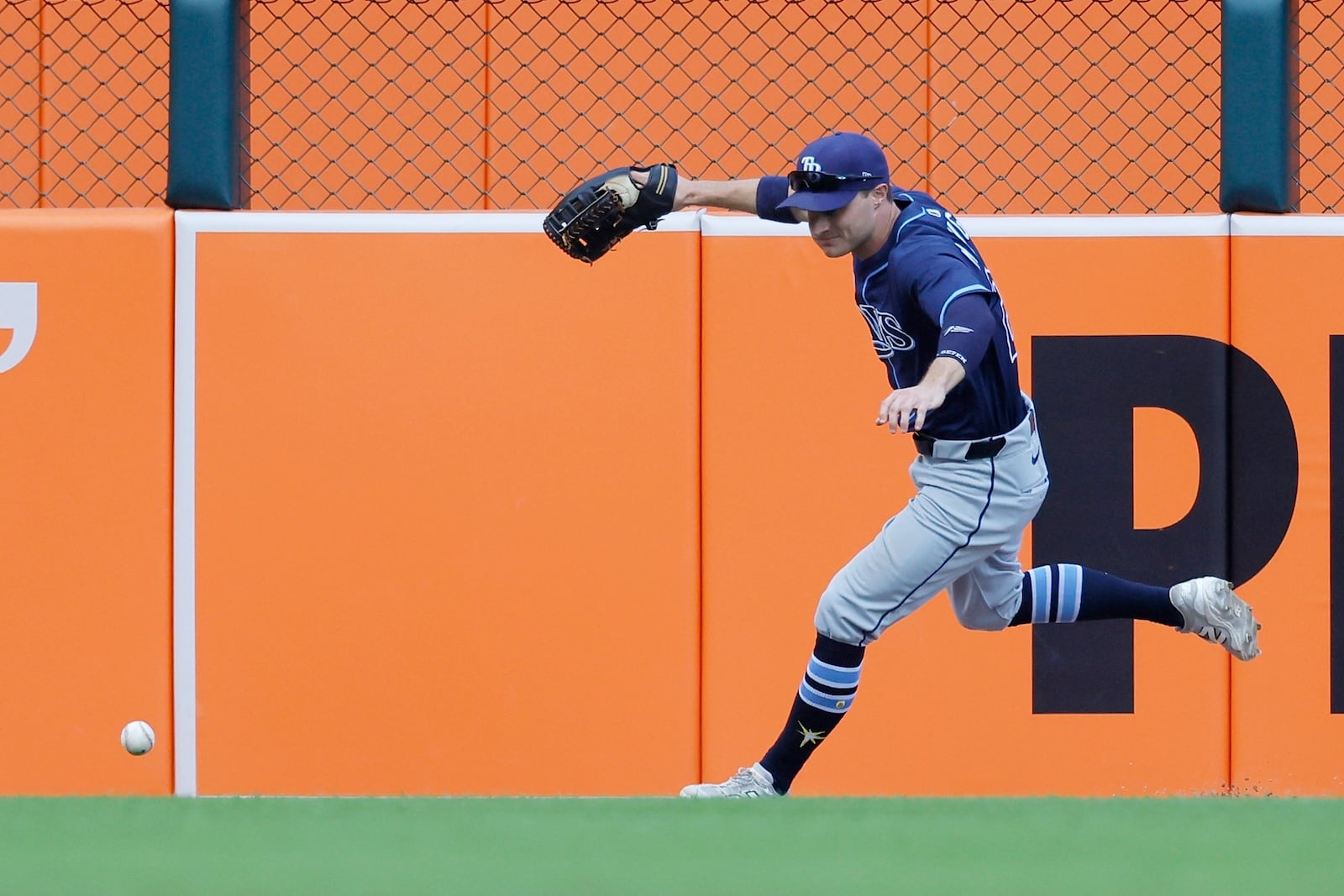Tampa Bay Rays left fielder Jake Mangum chases down a double hit by Detroit Tigers' Gleyber Torres during the fourth inning of a baseball game Wednesday, July 9, 2025, in Detroit. (AP Photo/Duane Burleson)