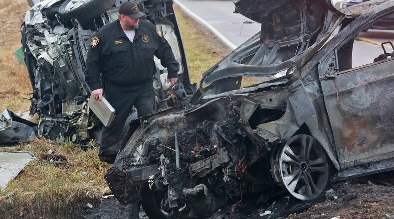 A fiery crash in the 2700 block of Clark Road in Champaign County left one driver dead and the other seriously injured Tuesday, Dec. 6, 2022. The Champaign County Sheriff's Department said it appeared that one of the cars went left of center and struck the other head on. One of the cars then cought fire. BILL LACKEY/STAFF