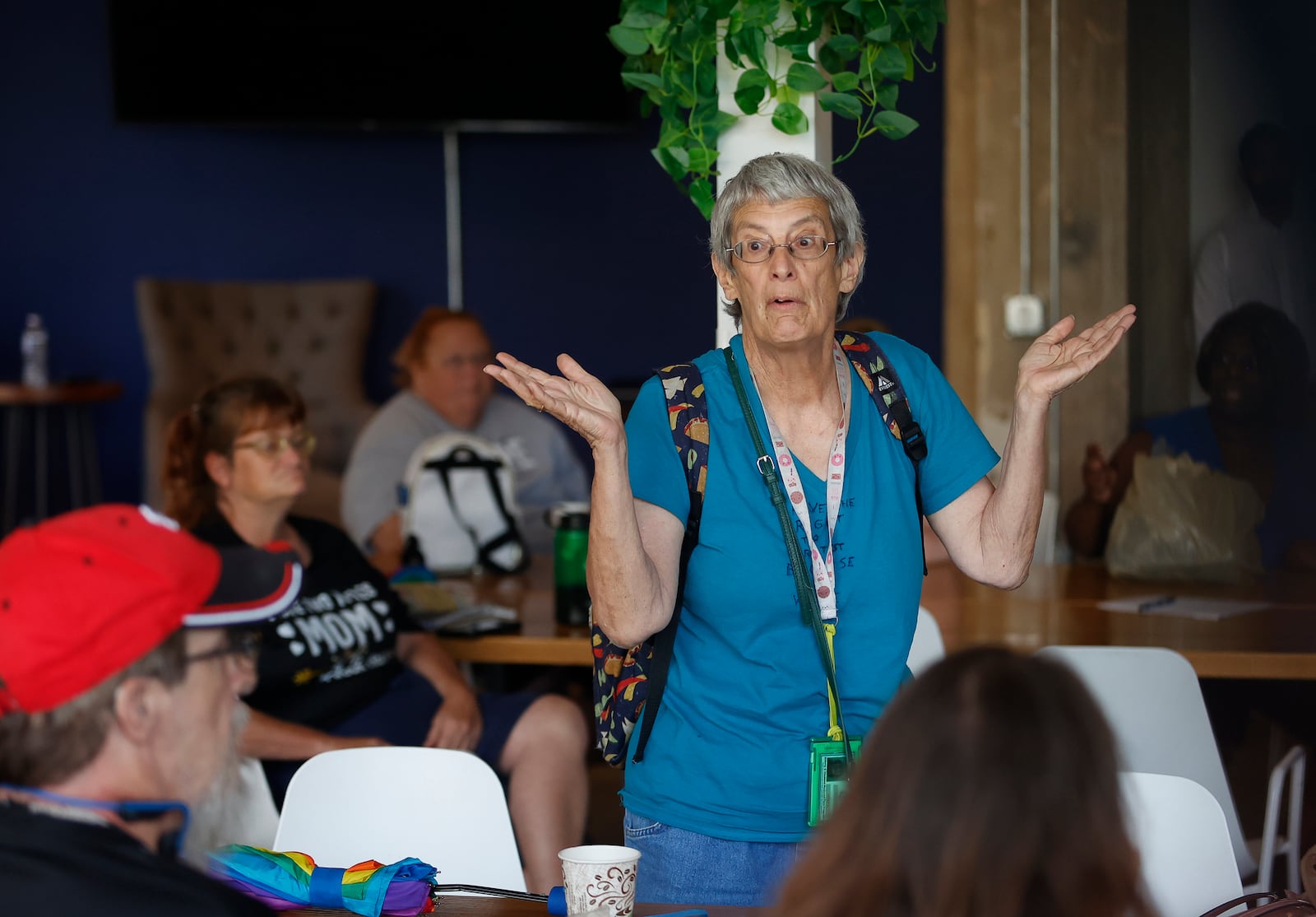 SCAT bus rider Carolyn Thomas, center, of Springfield, shares her concerns about bus changes during a public information meeting held on Tuesday, July 1, 2025, in the Exchange Room at Myers Market, for the community to learn and give their opinions on the new public transportation system. JOSEPH COOKE/STAFF