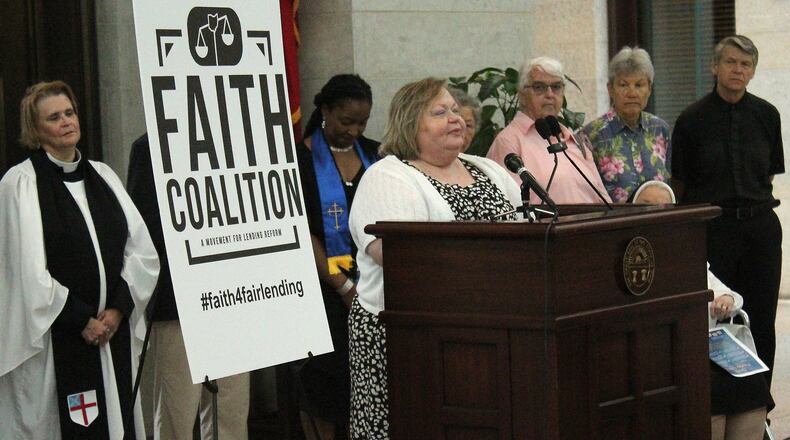 Springfield resident, Denise Cook Brooks tells her story dealing with payday lenders at an event at the Ohio Statehouse in June. JEFF GUERINI/STAFF